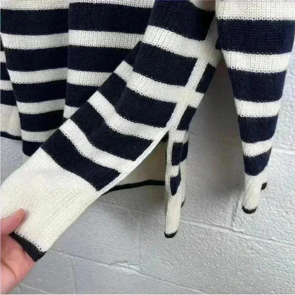 COS Roll neck sweater in white and black striped wool and cotton blend